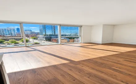 sunlit_empty_apartment_with_city_views