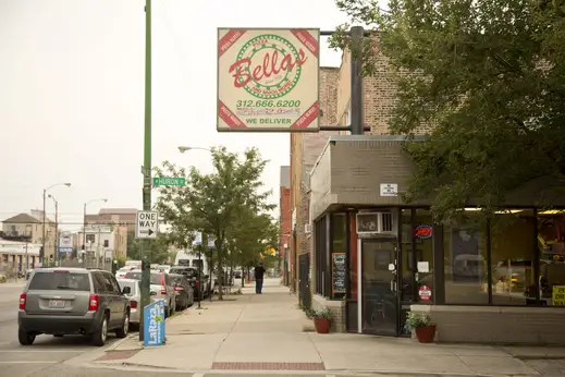Bellas restaurant sign and front entrance on W Huron St in East Village Chicago
