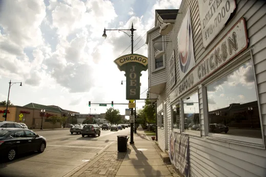 Chicago Joe's sign and traffic on W Irving Park Rd in St. Ben's Chicago