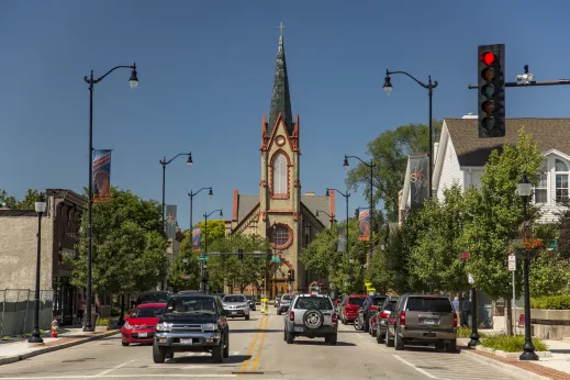 Church at end of street with cars on road in Skokie, IL