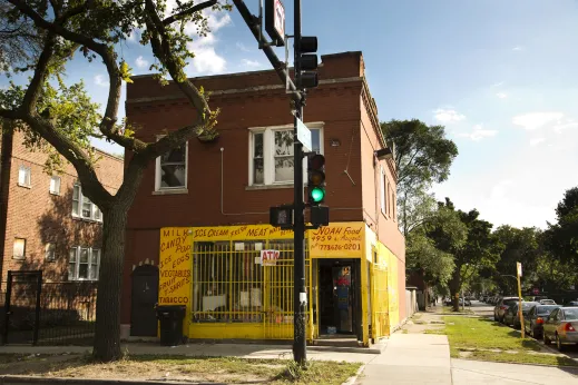 Convenience store near apartments on street corner in Austin Chicago