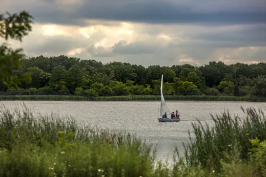 Family sailing in small boat on lake in Schaumburg, Illinois