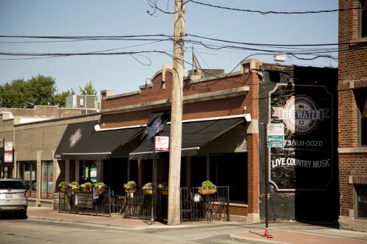 Firewater Saloon front outdoor seating on N Oliphant Ave in Edison Park