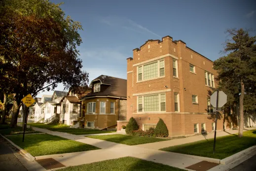 Newly mowed grass in frojt of apartments in Kilbourn Park Chicago