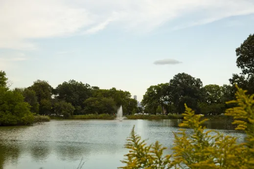 Garfield Park fountain in lagoon near apartments in West Garfield Park Chicago