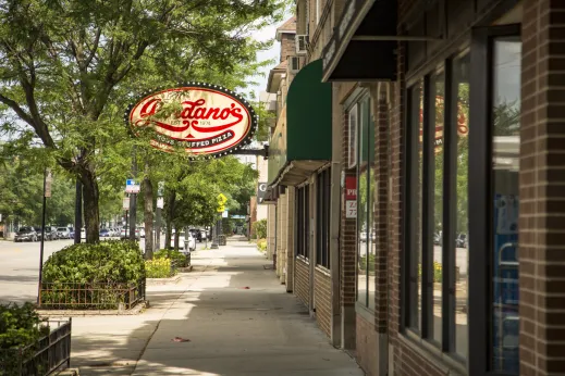 sidewalk with trees in front of Giordanos Pizza in Dunning Chicago