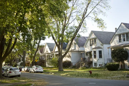 autumn streetscape with single family homes and cars parked on side street in Bowmanville Chicago