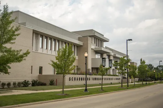 Schaumburg library exterior with grass and sidewalk in front