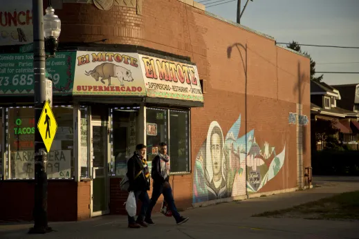 Men walking by supermarket in Kilbourn Park Chicago