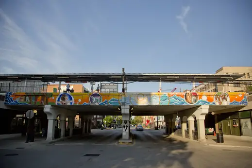 Morse CTA Red line elevated station and public art mural in Rogers Park Chicago