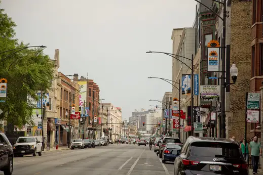 North Clark Street businesses with cars and bike lane in Lakeview Chicago