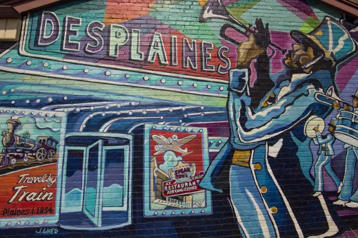 Painting musician colorful brick revolving door train Des Plaines