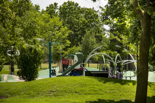 children playing in the sprinkler in the park in Dunning Chicago