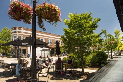 People dining flowers hanging sidewalk Wilmette