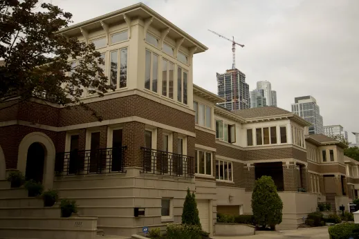 Prairie style windows and sunrooms with condos, apartments, and highrises in the background in Dearborn Park Chicago