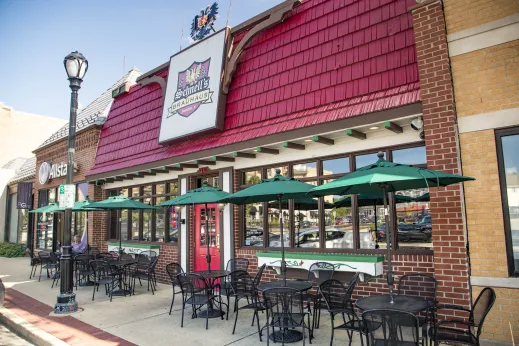 Schnells Brauhaus storefront with red roof and door in Palatine, Illinois