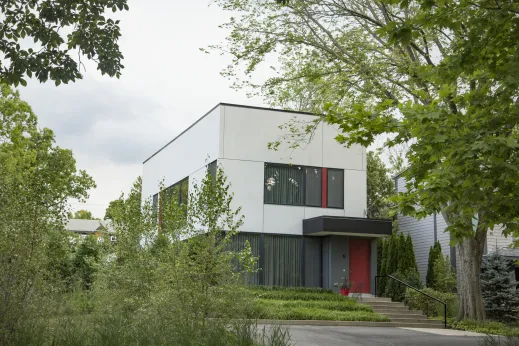 large white single family home with red front door in Highland Park