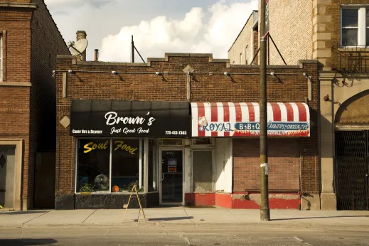 Soul-Food restaurant on street by apartments for rent in Austin Chicago
