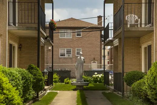 stone statue in the courtyard of apartment building in O’Hare neighborhood of Chicago
