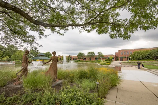 sculpture if man and woman in prarie grass in Schaumburg, Illinois