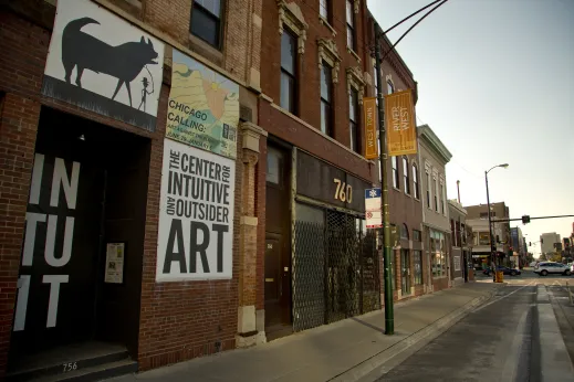 STore fronts, signs, and bike lane on N Milwaukee Ave in River West Chicago