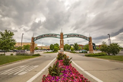 Woodfield mall entrance with beautiful flowers down middle of street in Schaumburg, Illinois
