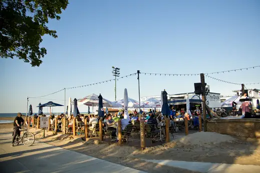 The Dock restaurant cafe with outdoor seating patio at Lake Michigan beach in Uptown Chicago