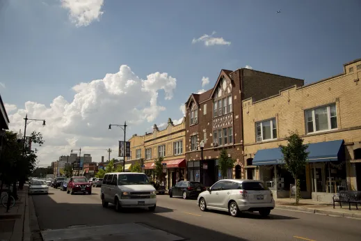 Tudor style apartment building and retail shops on the ground floors in North Park Chicago