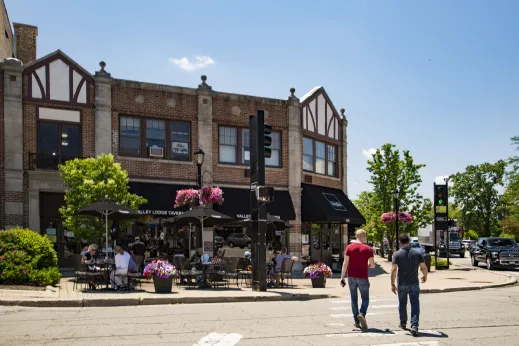 Valley Lodge Tavern men walking street dining Wilmette