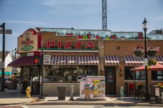 Village Inn Pizzeria eterior with red and white awning in Skokie Illinois