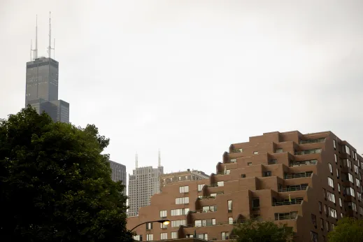 Willis Tower visible above treetops and apartment buildings in Dearborn Park Chicago