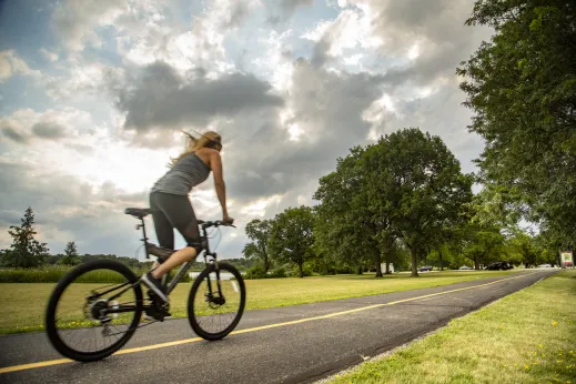 woman biking on rustic trail in Schaumburg, Illinois