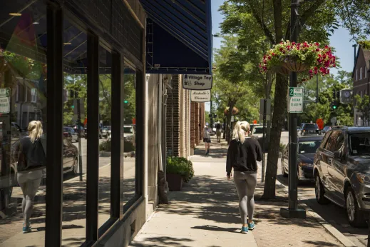 Woman walking village toy shop sidewalk Winnetka