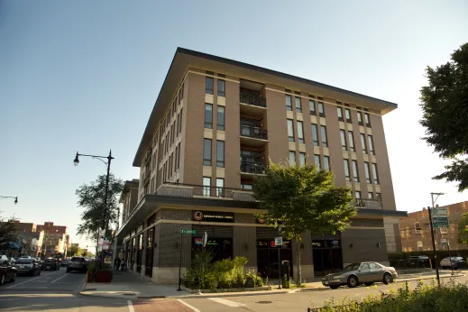 Apartment building and retail businesses on ground floor on S Halsted St in Bridgeport Chicago