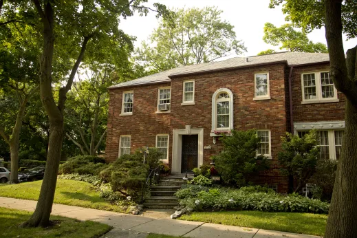 Brick Colonial style house with front steps and garden in Hollywood Park