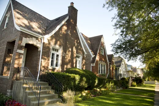 Brick single family homes and front gardens in Norwood Park Chicago