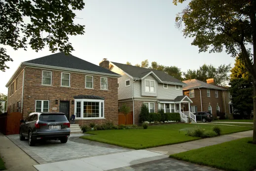 Brick single family homes and front yards in Sauganash