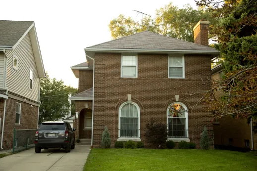 Brick two story house exteriors and driveway in Sauganash