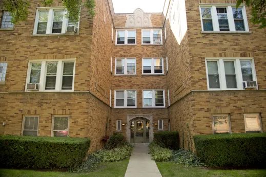 Brick vintage apartment building front entrance in Mayfair Chicago