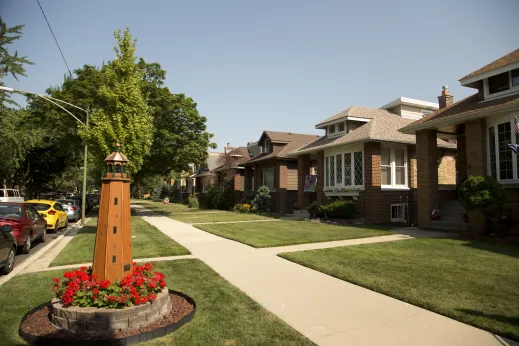 Bungalow style houses and lighthouse lawn ornament in Portage Park Chicago