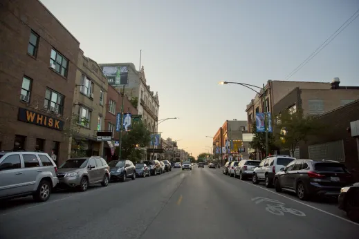 Cars parked on either side of N Clark St near Wrigley Field in Wrigleyville Chicago