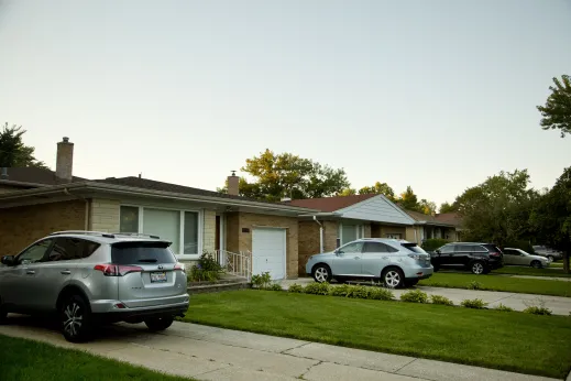 Cars parked in driveways at single family homes in Sauganash