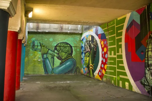 Colorful murals painted in Metra station viaduct in Woodlawn Chicago