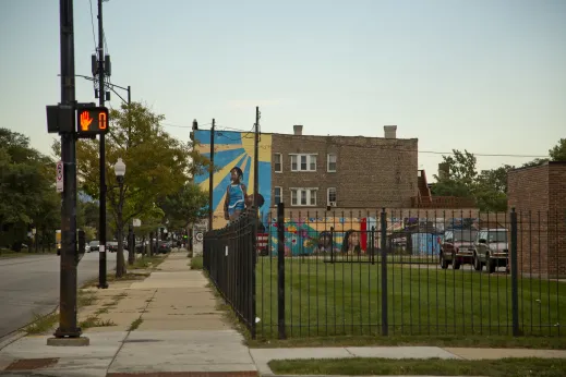 Colorful murals painted on side of apartments in West Garfield Park Chicago