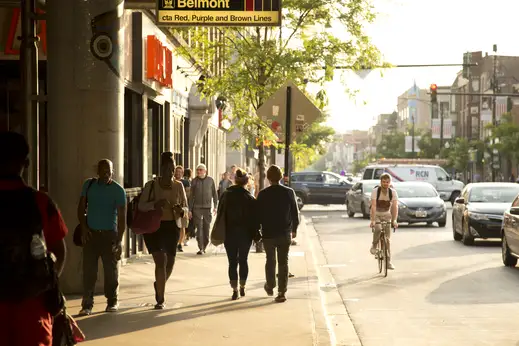 Commuters outside Belmont CTA station in Lakeview Chicago