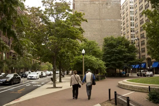 Couple holding hands and walking in Printer's Row Chicago