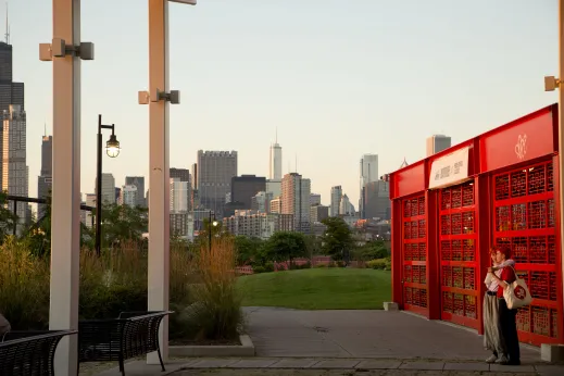 Couple looking at sunset from Ping Tom Park with Chicago skyline in Chinatown