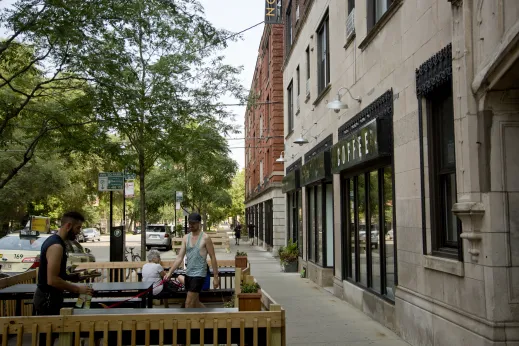 Customers outside coffee shop with patio seating in Sheridan Park