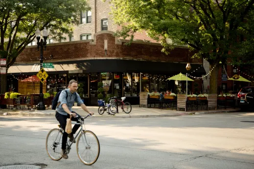 Cyclist crossing W HErmitage Ave on N Wilson Ave in Ravenswood Chicago