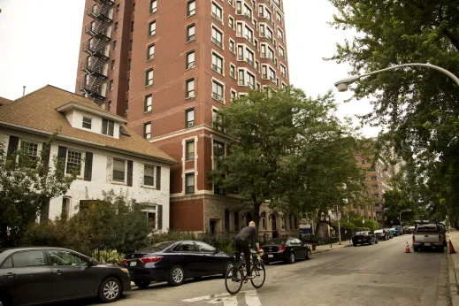 Cyclist in front of apartment building in Buena Park Chicago